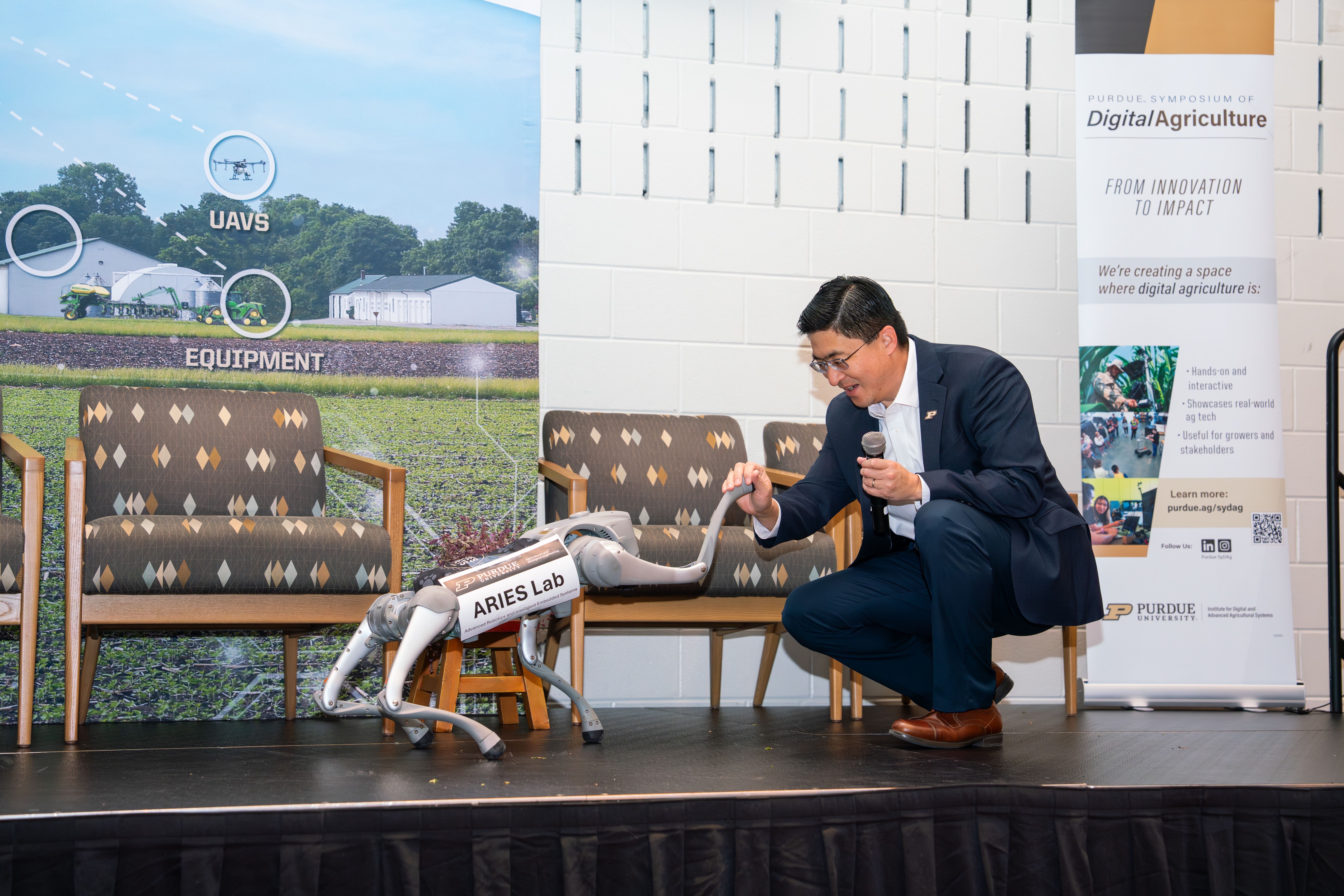 SyDAg 2025 symposium attendees and venue